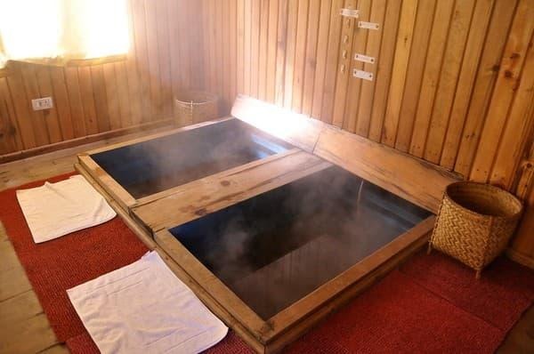 Traditional Bhutanese hot-stone bath (Dotsho) in Bhutan